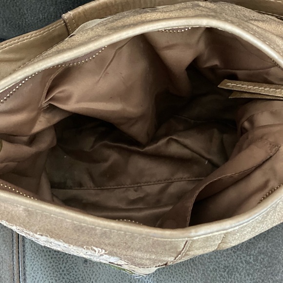Brown Coach bag with flower designs